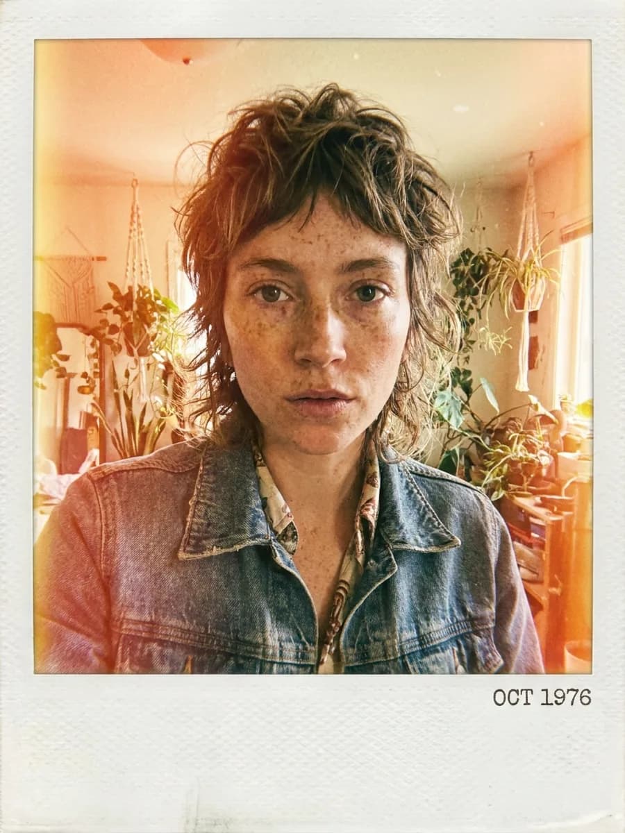 Polaroid instant film photo style, slightly overexposed warm colors, vintage fil